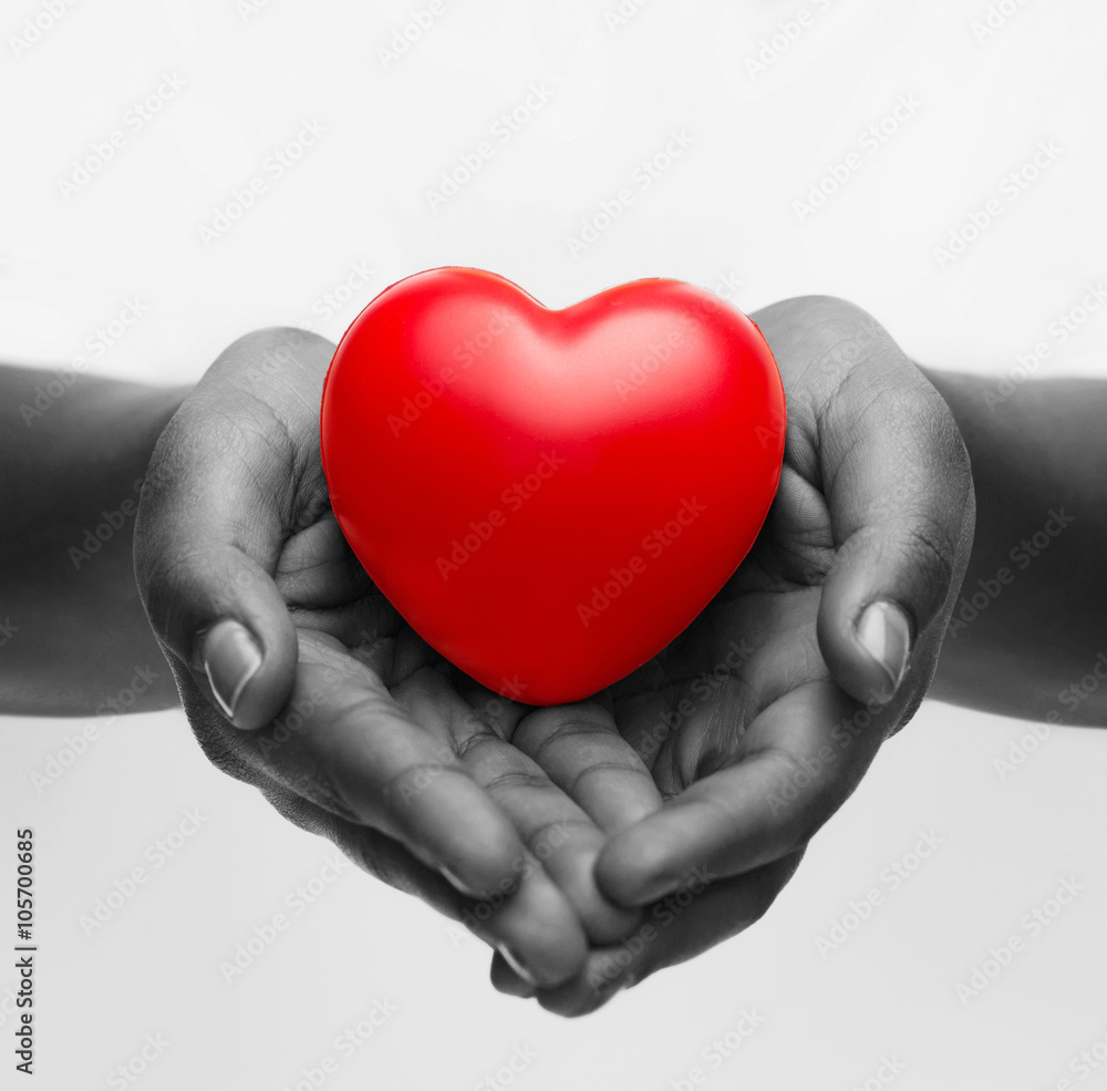 Fototapeta premium female hands with small red heart