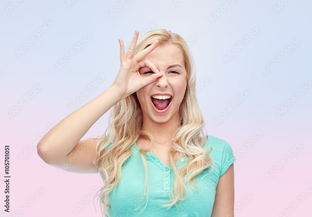 young woman making ok hand gesture young woman making ok hand gesture