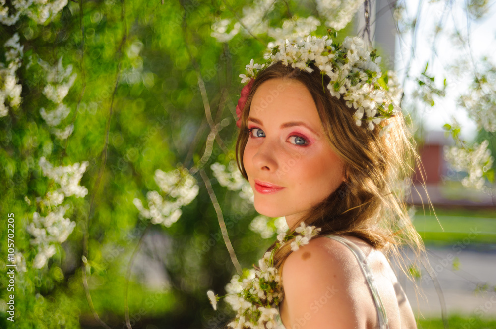 beautiful  woman in a spring garden