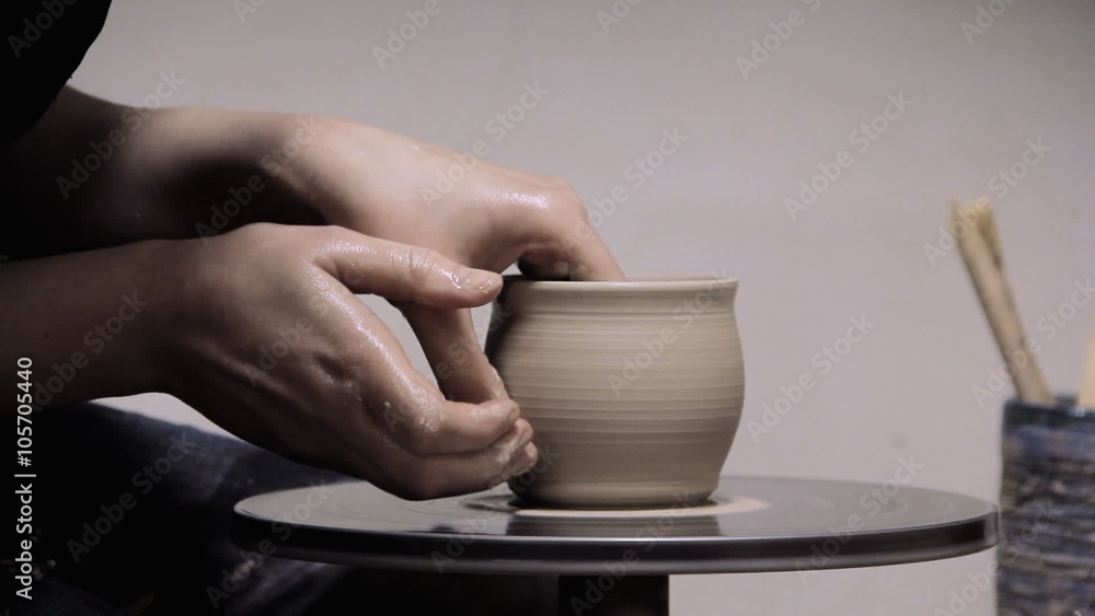 Potter Creates the Product on a Potter's Wheel Potter Creates the Product on a Potter's Wheel