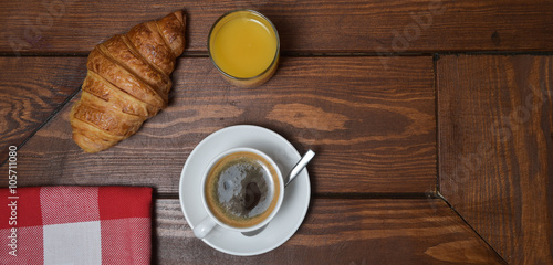Shot Of Coffee And Croissant On Table