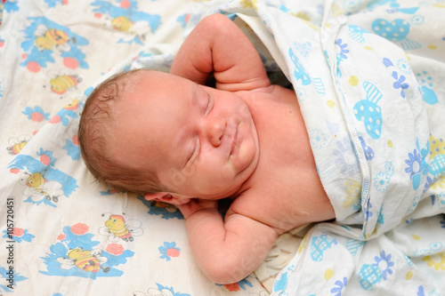 Newborn Baby in Bed