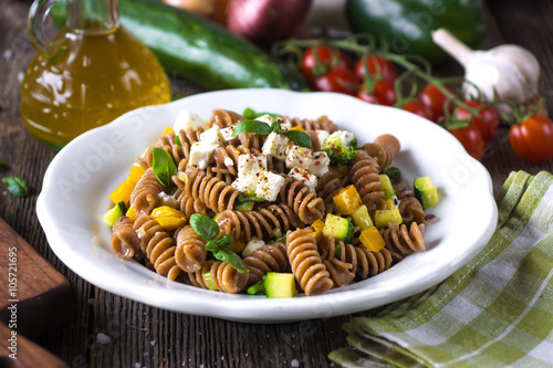 Whole wheat pasta with vegetables and feta