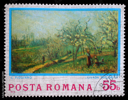Stamp printed in Romania shows Orchard in Bloom, Painting by Camille Pissarro, circa 1974 photo