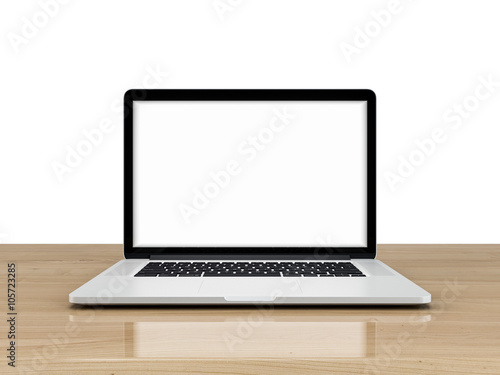 Laptop with blank screen isolated on white background, white aluminium body on blue wooden desk.