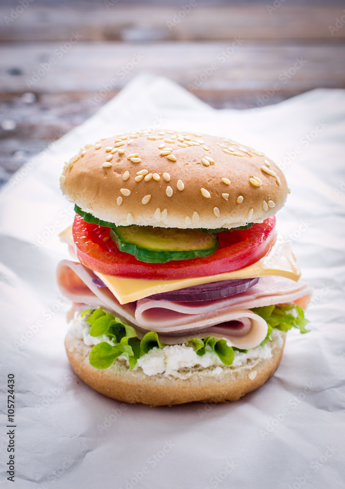 Sandwich with ham, cheese and fresh vegetables Sandwich with ham, cheese and fresh vegetables