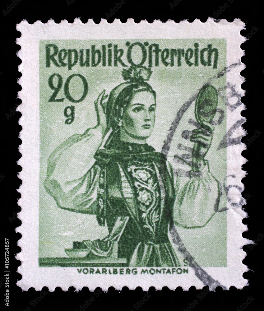 Stamp printed in Austria shows image woman in national Austrian costumes, Vorarlberg, Montafon Valley, series, circa 1948 Stamp printed in Austria shows image woman in national Austrian costumes, Vorarlberg, Montafon Valley, series, circa 1948
