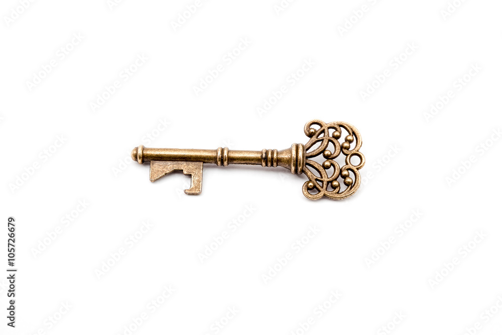 brass key on white brass key on white