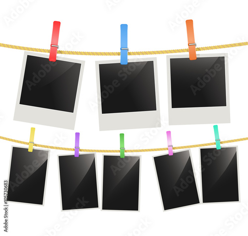 Photo frames hanging on a rope with multi color clothespins