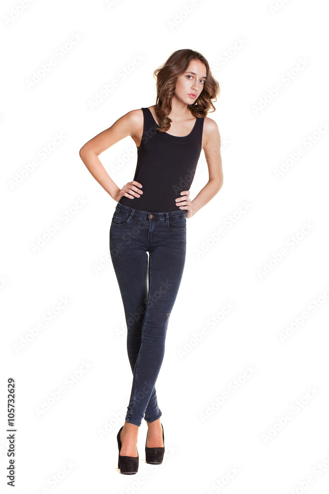 Portrait of a beautiful woman in blue jeans and blue shirt Portrait of a beautiful woman in blue jeans and blue shirt
