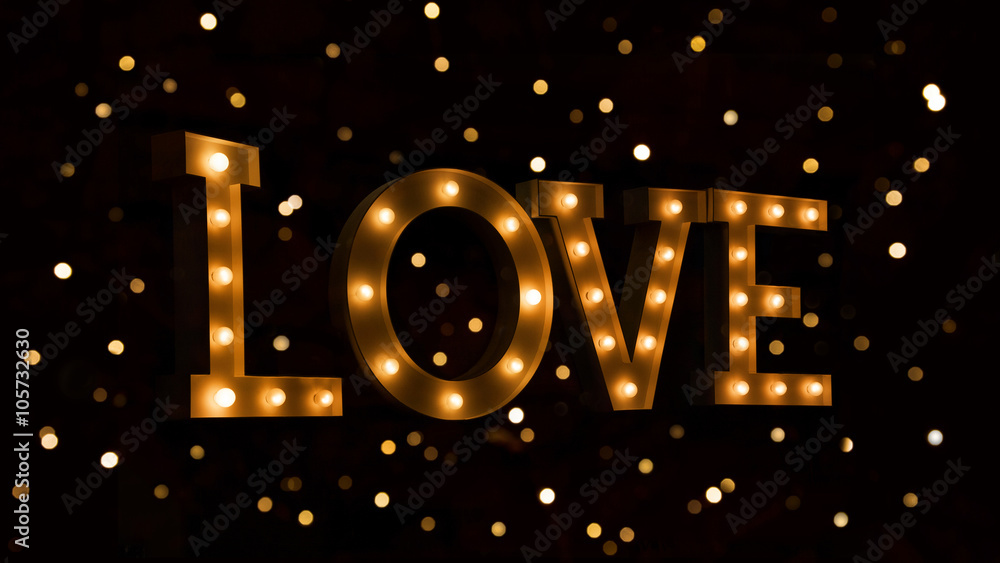 Love text with glowing light bulbs Love text with glowing light bulbs