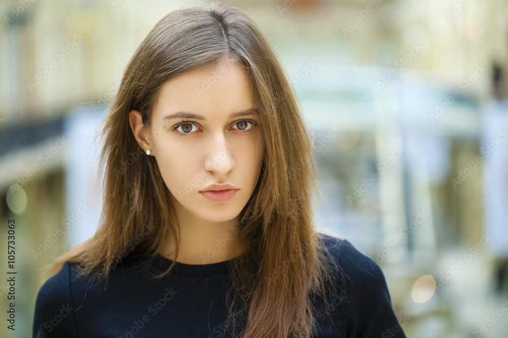 Close up of young beautiful woman in black dress Close up of young beautiful woman in black dress
