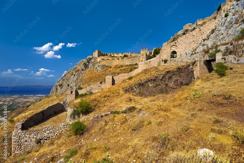 Greece. Acrocorinth (the acropolis of ancienth Corinth) - fortified citadel formed on the top of monolithic rock. There is the Corinthian Gulf in the background