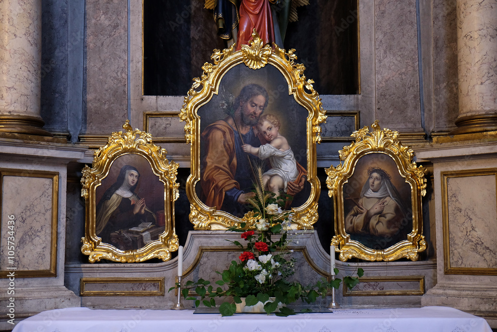 Saint Joseph holding child Jesus, painting on the altar in the St Nicholas Cathedral in Ljubljana, Slovenia