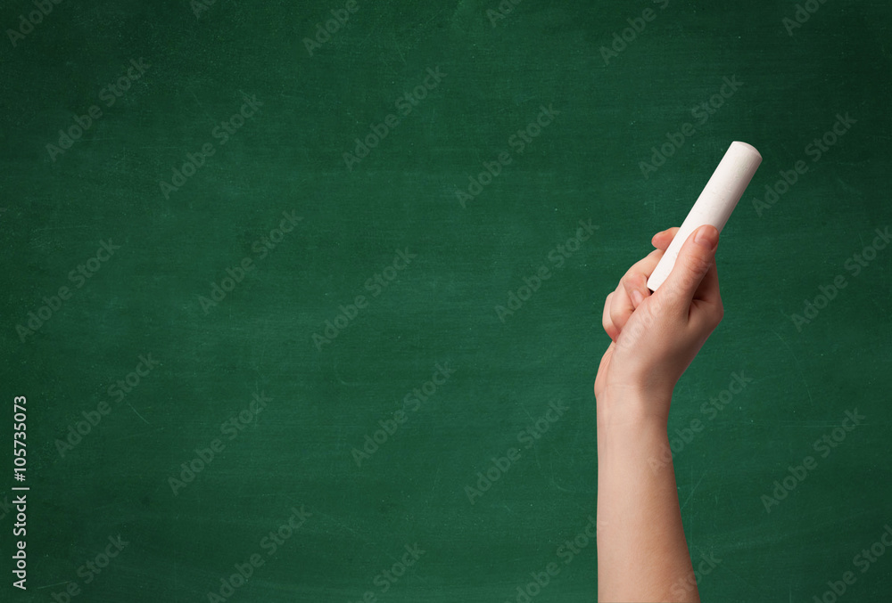 Hand writing on clean blackboard Hand writing on clean blackboard