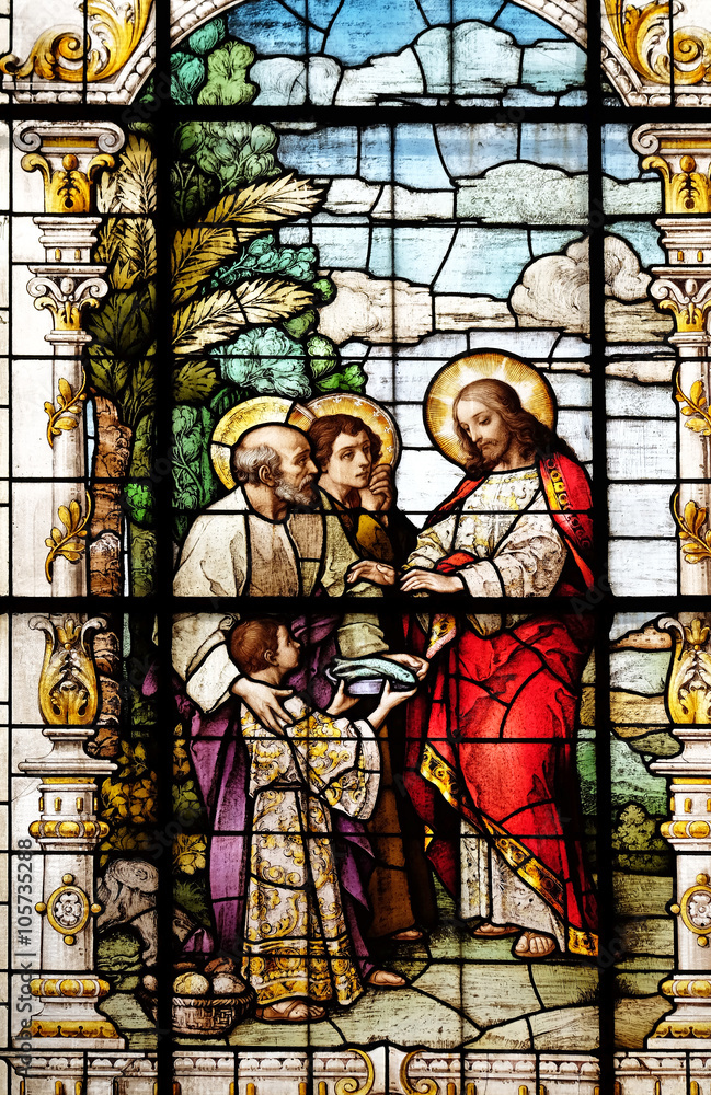 The Multiplication of the Loaves and Fish, stained glass window in the Basilica of the Sacred Heart of Jesus in Zagreb, Croatia