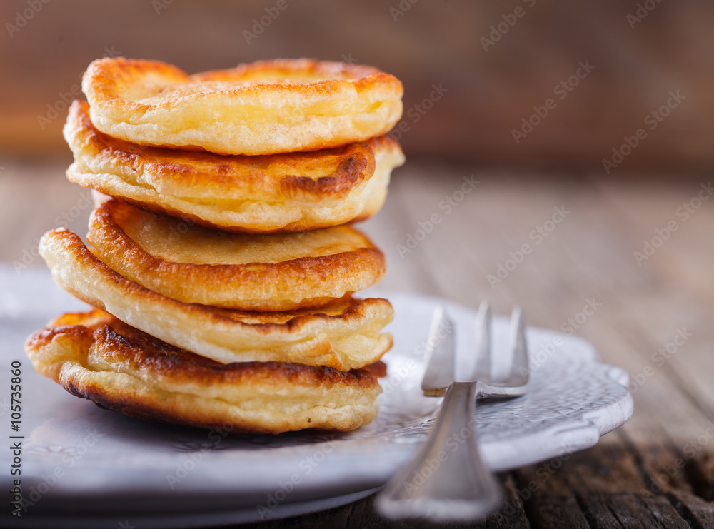 Pancake folded stack on wooden background.selective focus. Pancake folded stack on wooden background.selective focus.