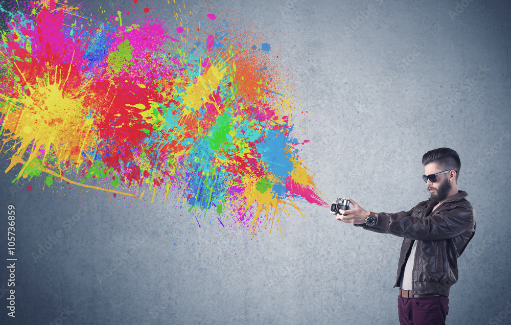 Hipster guy with camera and paint splash Hipster guy with camera and paint splash