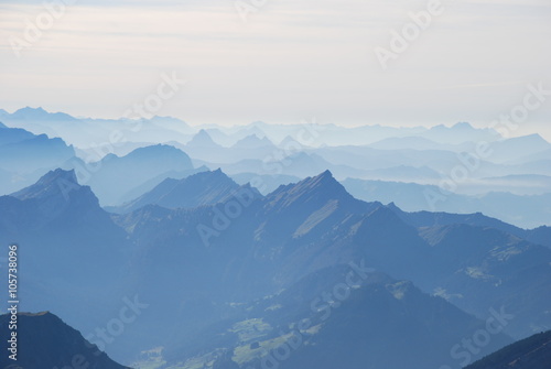 Mountain range in mist Swiss alps