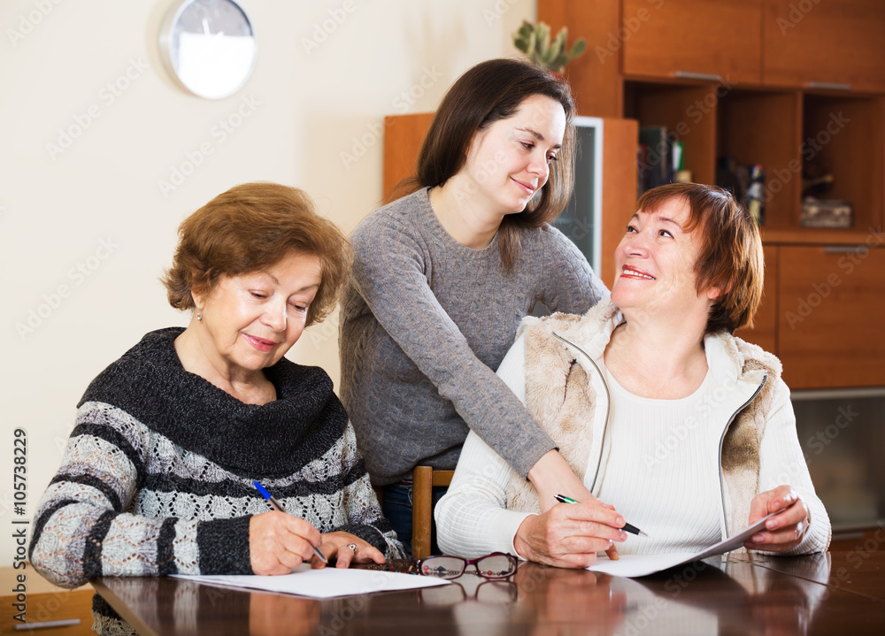 Fototapeta premium Three women with papers