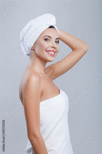 Cheerful young woman is resting after shower