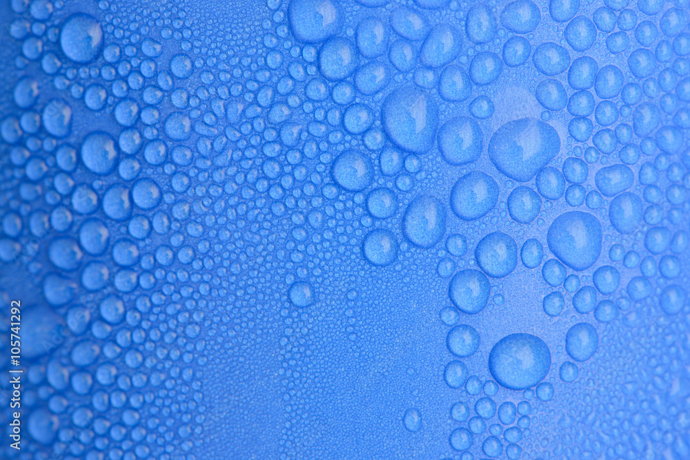 Water drops on blue curve paper cup