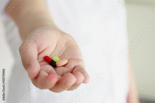 doctor hand holding medicine pills