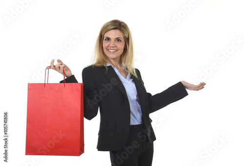 young happy beautiful woman in business suit in excited face expression holding red shopping bag