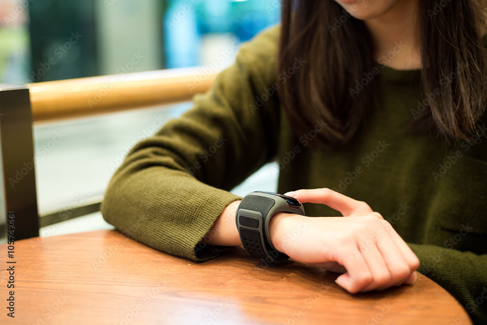 Woman touch on the smart watch