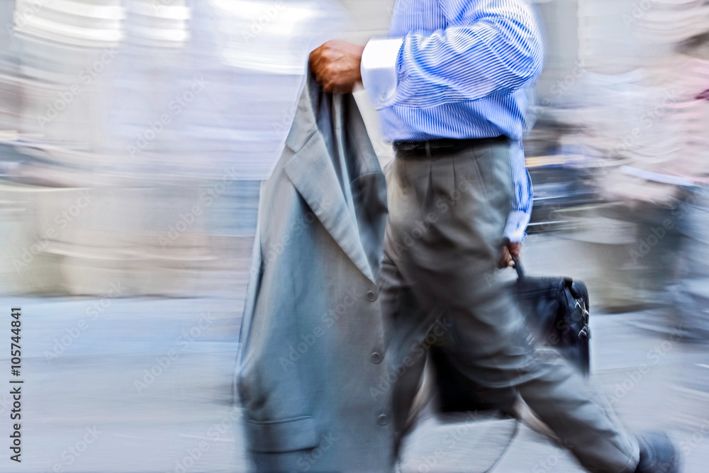 motion blurred business people walking on the street motion blurred business people walking on the street