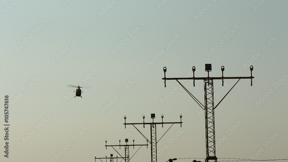 Runway lights and landing helicopter Runway lights and landing helicopter