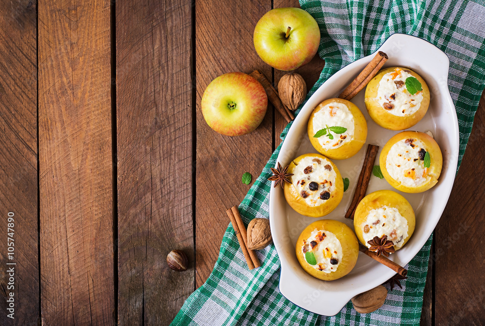 Appetizing baked apples with cottage cheese and raisins. Top view