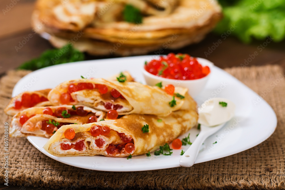 Pancakes with red caviar and cream cheese Pancakes with red caviar and cream cheese