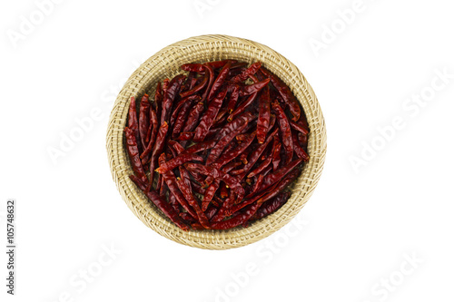 Dry red chili in the basket isolated on white