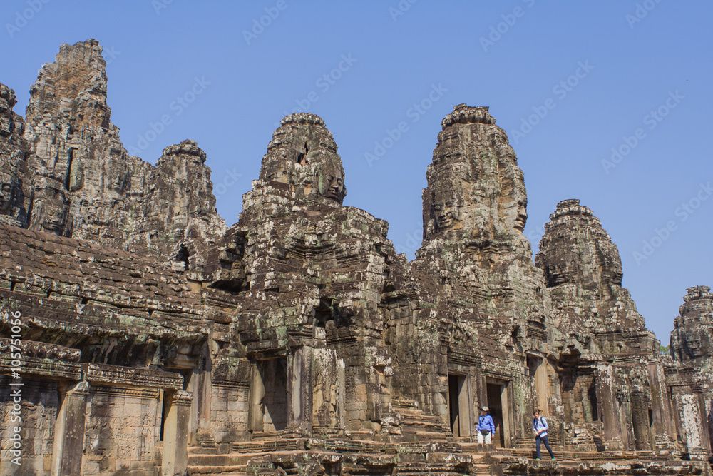 Stone head on towers of Bayon temple in Angkor Thom, Cambodia
