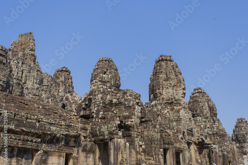 Stone head on towers of Bayon temple in Angkor Thom, Cambodia