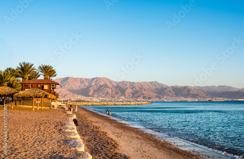 View of Eilat beach, Israel over Aqaba city, Jordan. photo
