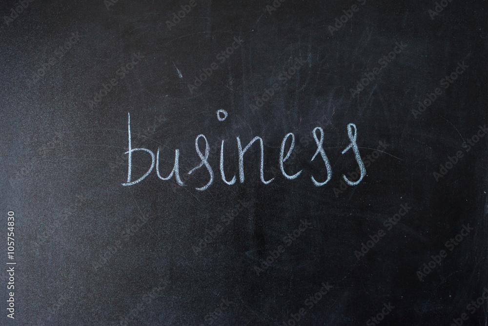 Obraz premium Business on blackboard.written the word on the board.
