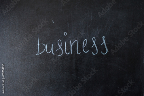 Business on blackboard.written the word on the board.