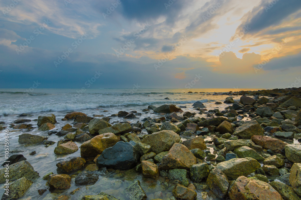 Beach stone with sunrise background Beach stone with sunrise background