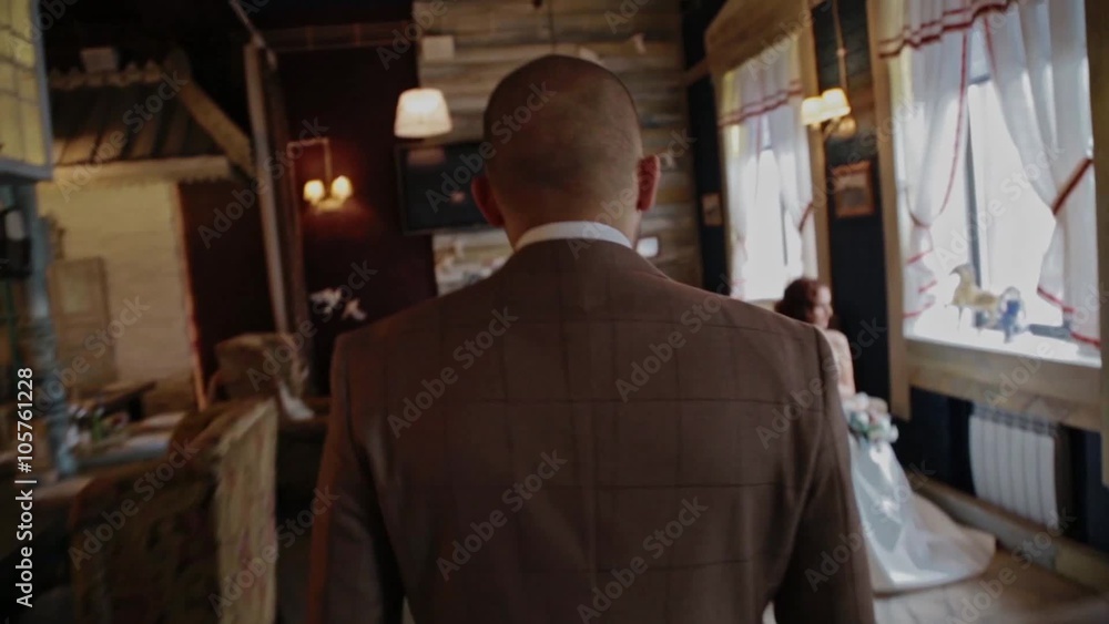 The groom goes to the bride in a vintage restaurant The groom goes to the bride in a vintage restaurant
