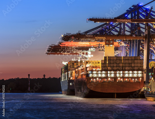 Hamburg Container Ship loading in the sunset