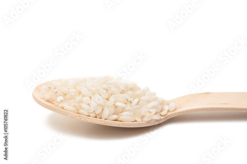 rice in a wooden spoon isolated