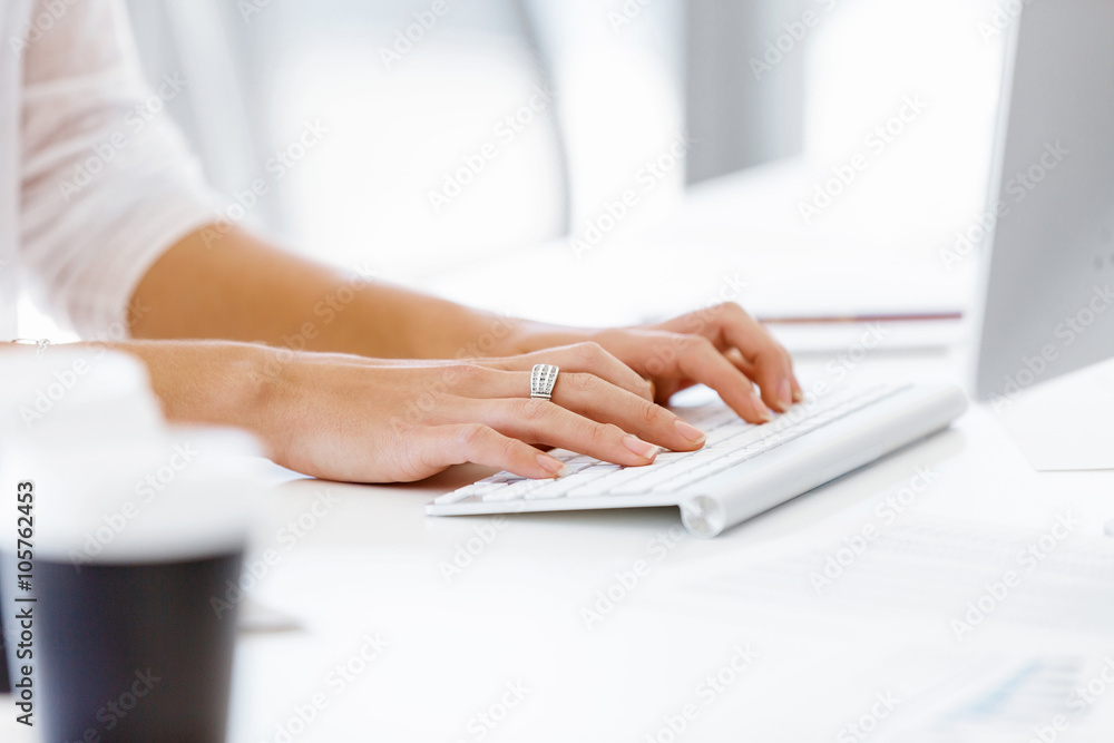 Female hands typing on the keyboard Female hands typing on the keyboard