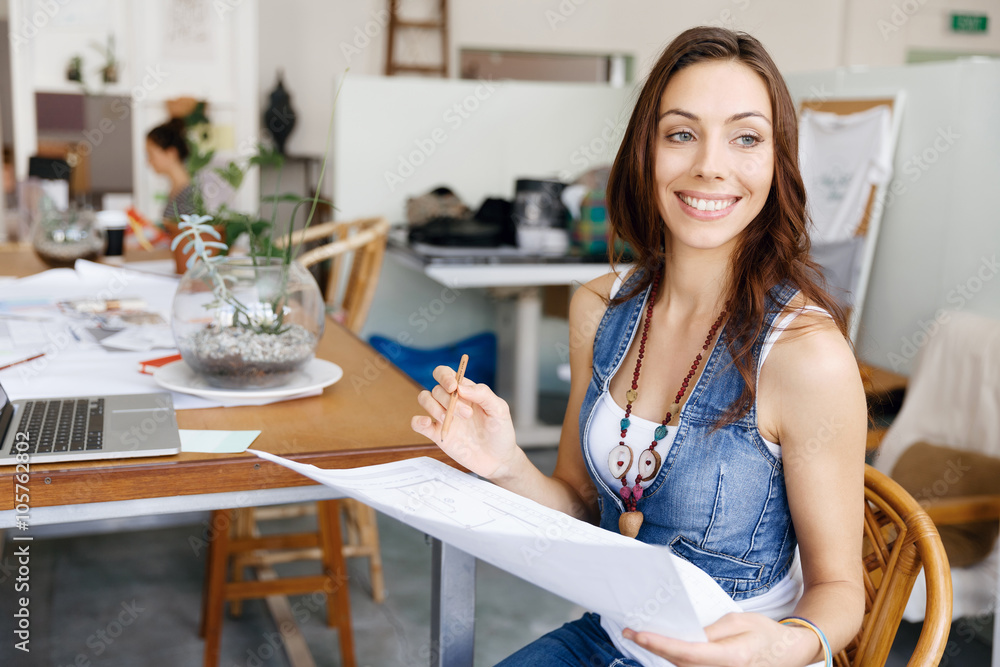 Young woman standing in creative office Young woman standing in creative office