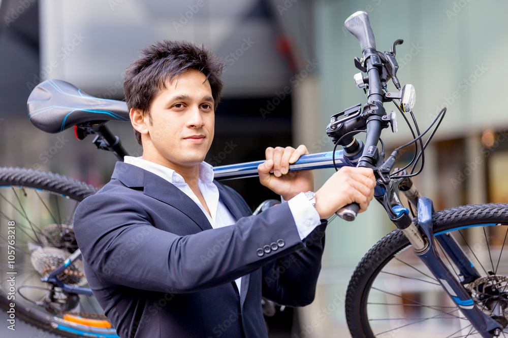 Successful businessman riding bicycle Successful businessman riding bicycle