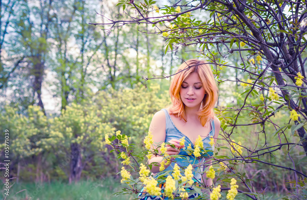 Young woman in the spring garden Young woman in the spring garden