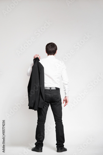 Businessman looking on an empty wall