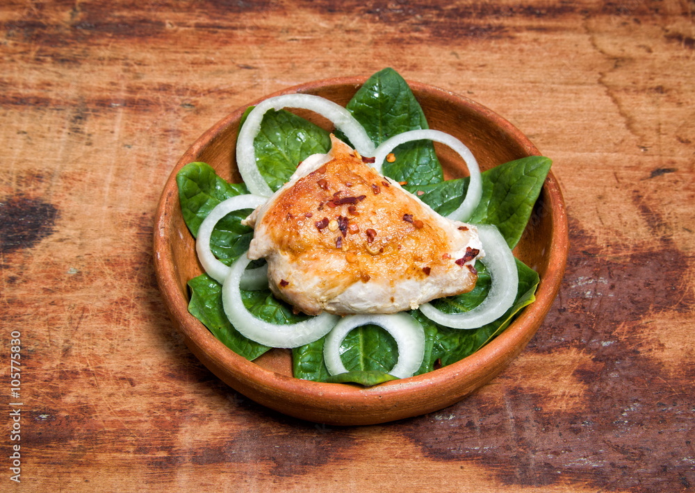 grilled chicken is served in a clay pot grilled chicken is served in a clay pot