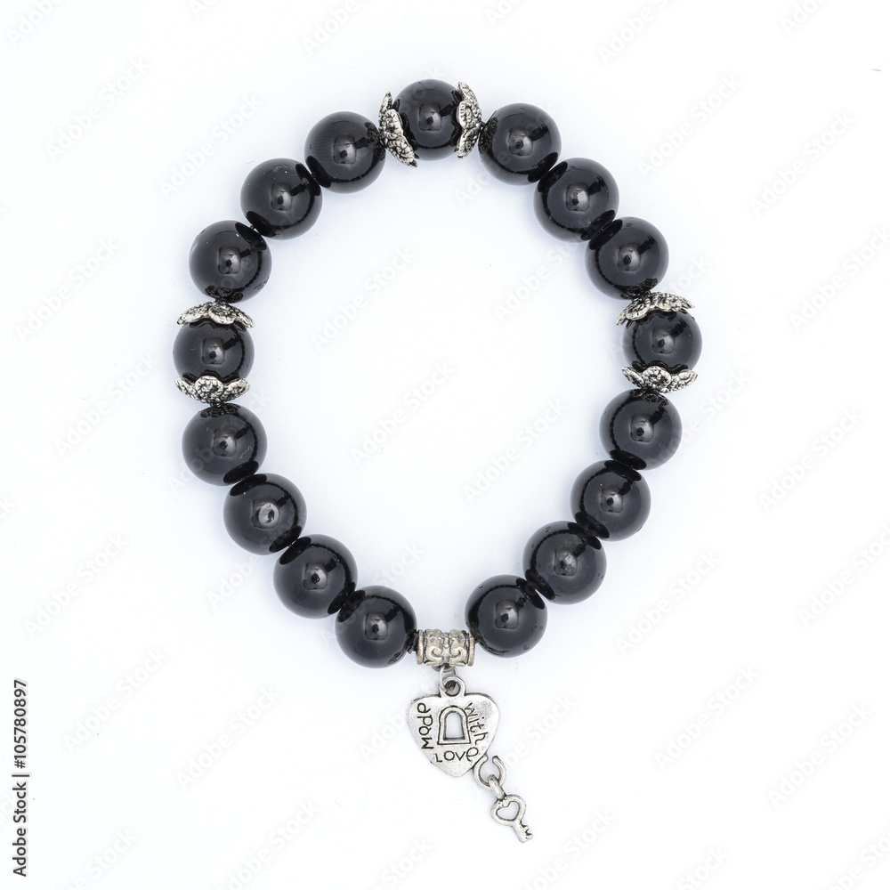 Fototapeta premium Black bracelet with pendant isolated